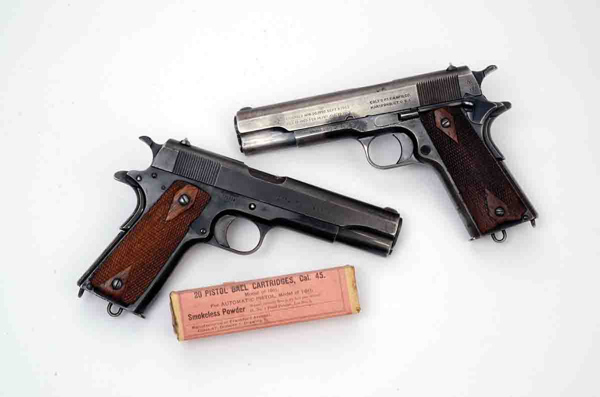 The 1917 vintage Colt 1911 (top) and a 1918 vintage Colt 1911 (bottom) are shot only with mild .45 ACP handloads containing Trail Boss.